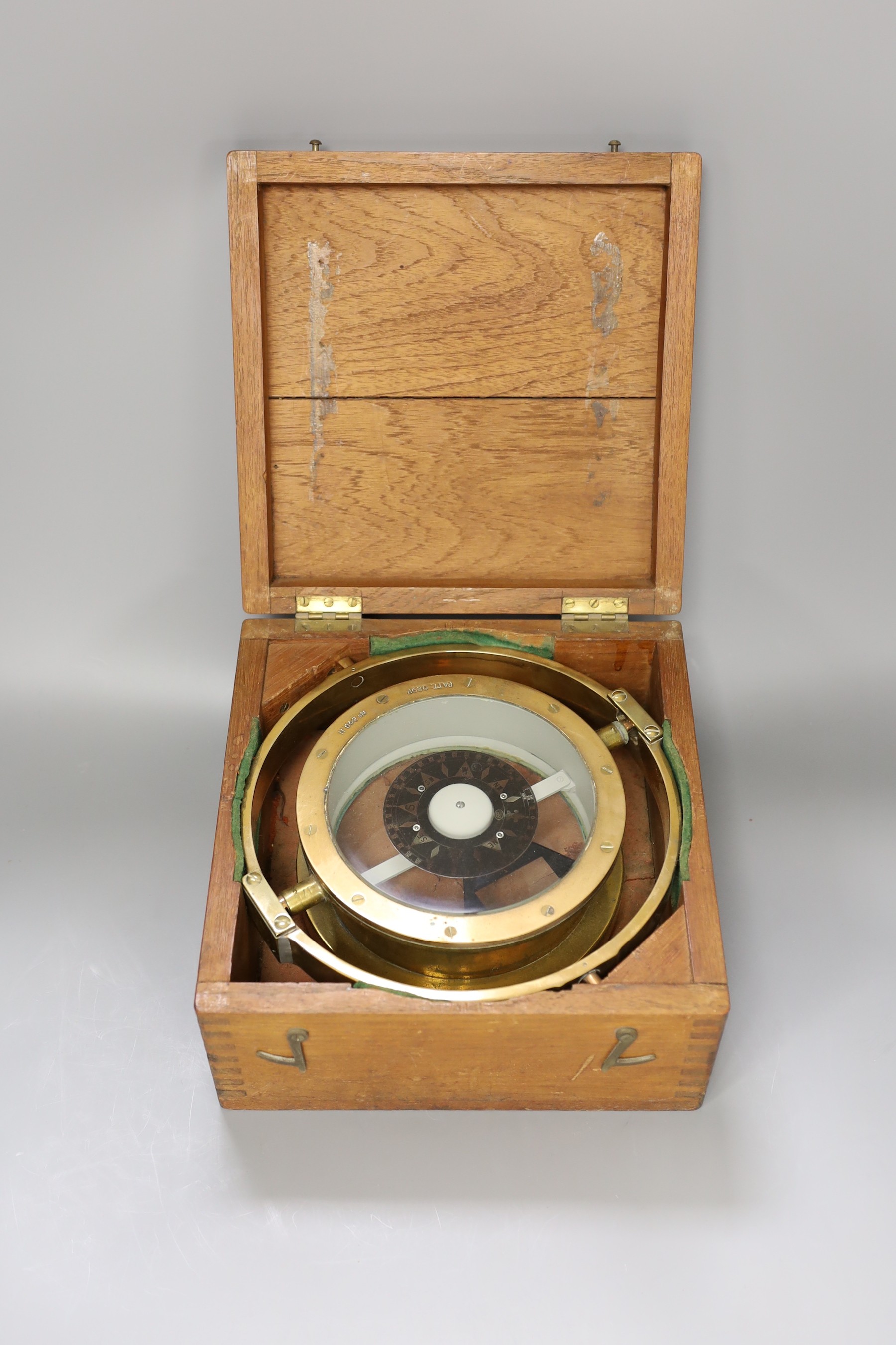 A wooden cased ship's compass, 14cm tall